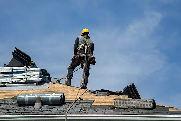 Professional Storm Damage Roof Repair technician working in Harrison, NJ